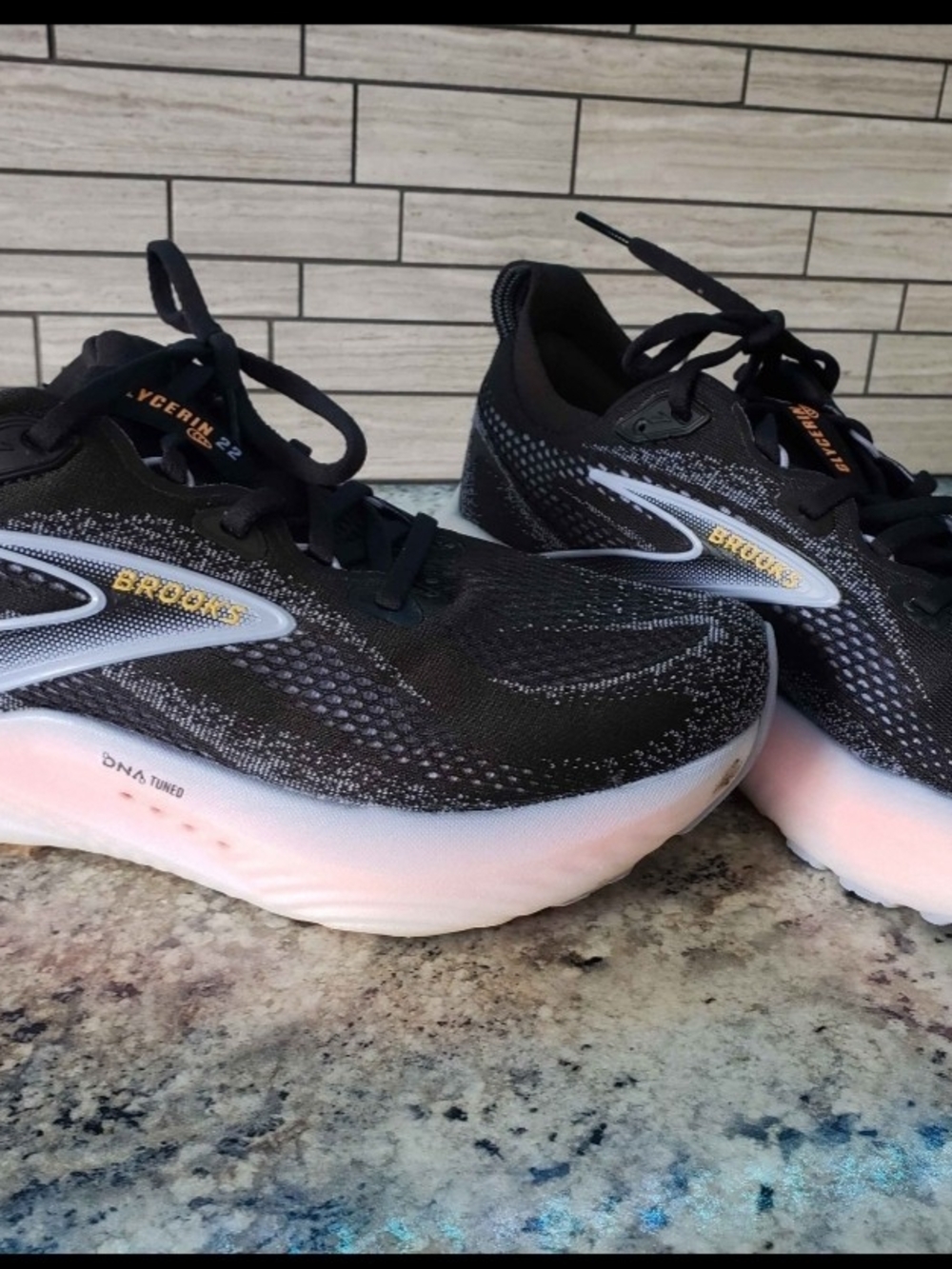 Brooks Women's Black Running Shoes with Subtle Pink Midsole and Gold Logo